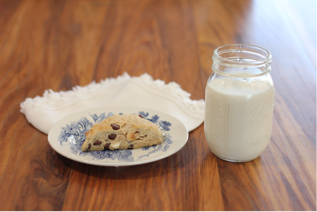 Sourdough Peanut Butter Chocolate Chip Scones with glass of milk.